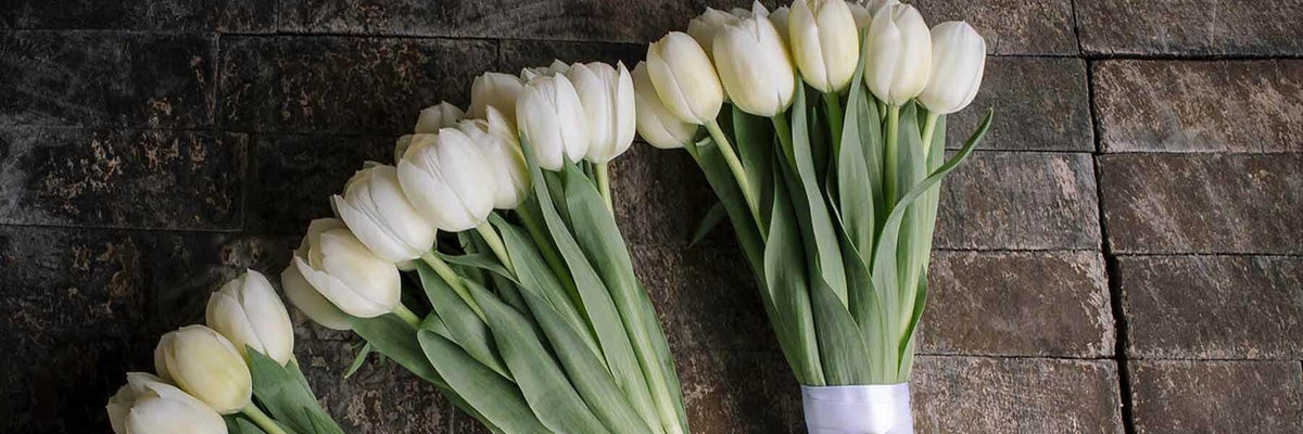 Florist preparing floral arrangement for delivery